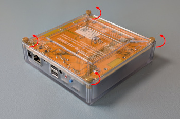 Image showing the bottom of the Yellow with arrows around the thumb-screws indicating counter-clockwise motion
